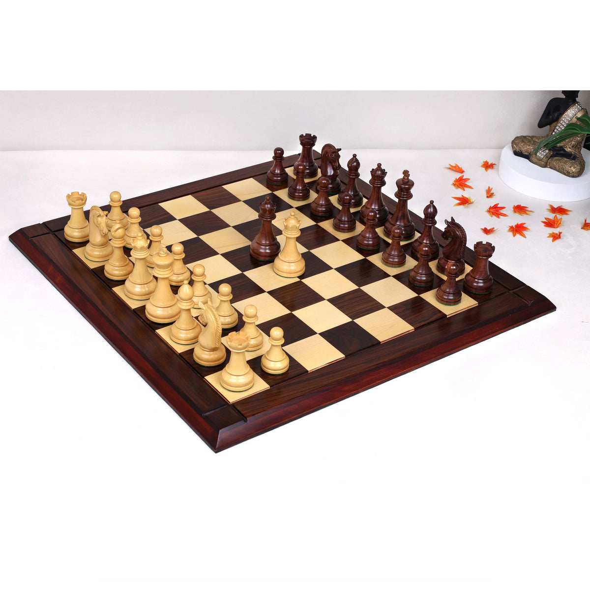 Sovereign Crown luxury chess set arranged on a matching rosewood and maple wooden chessboard