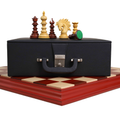 Luxury Staunton chess pieces displayed on a storage box and board.