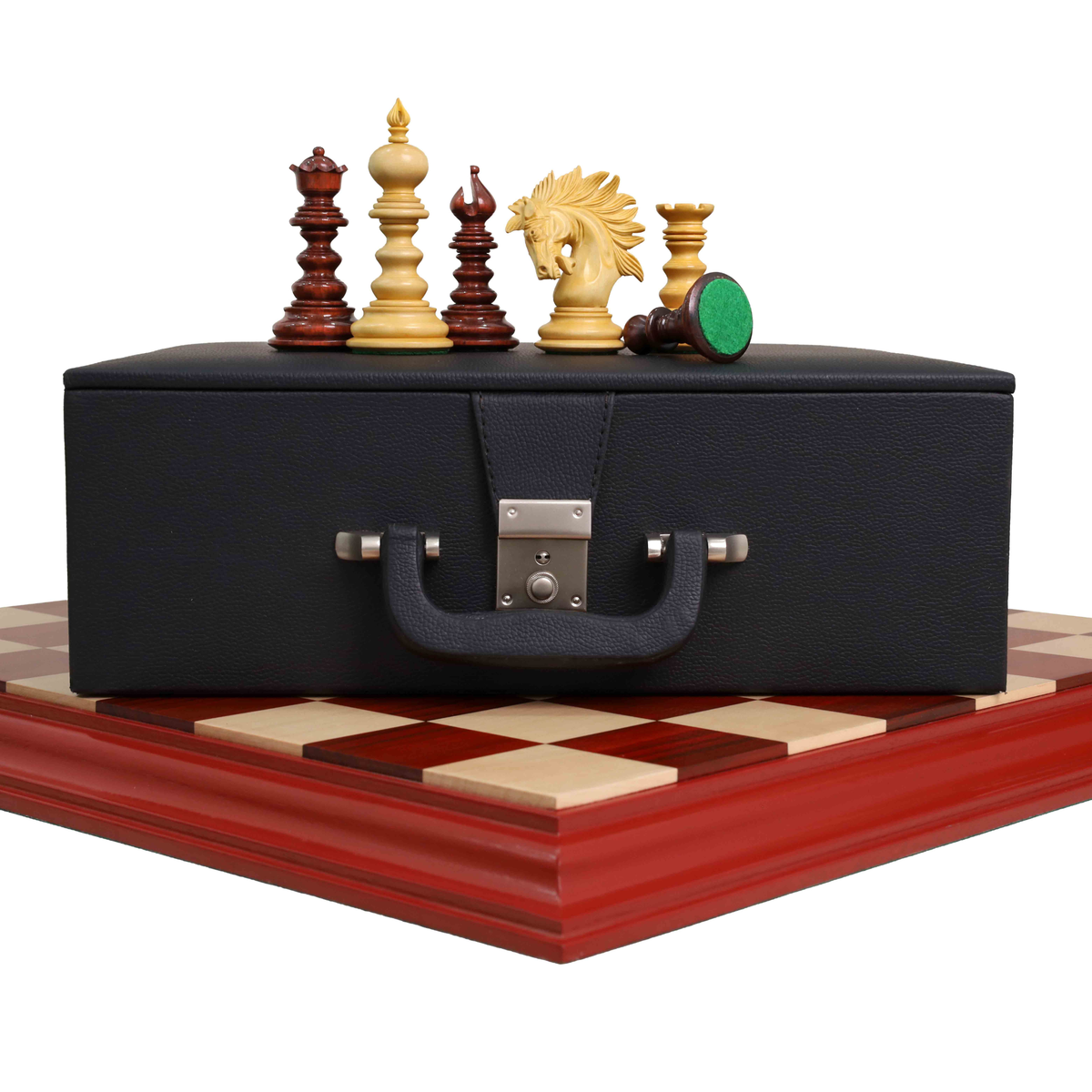 Luxury Staunton chess pieces displayed on a storage box and board.