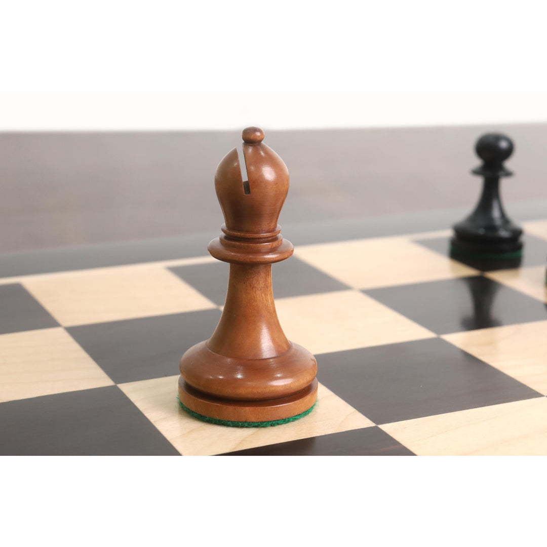Antiqued boxwood bishop with traditional mitered cut from the American Chess Company reproduction series.