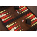 Detailed view of the backgammon set interior featuring black dice cups and ivory-colored dice.