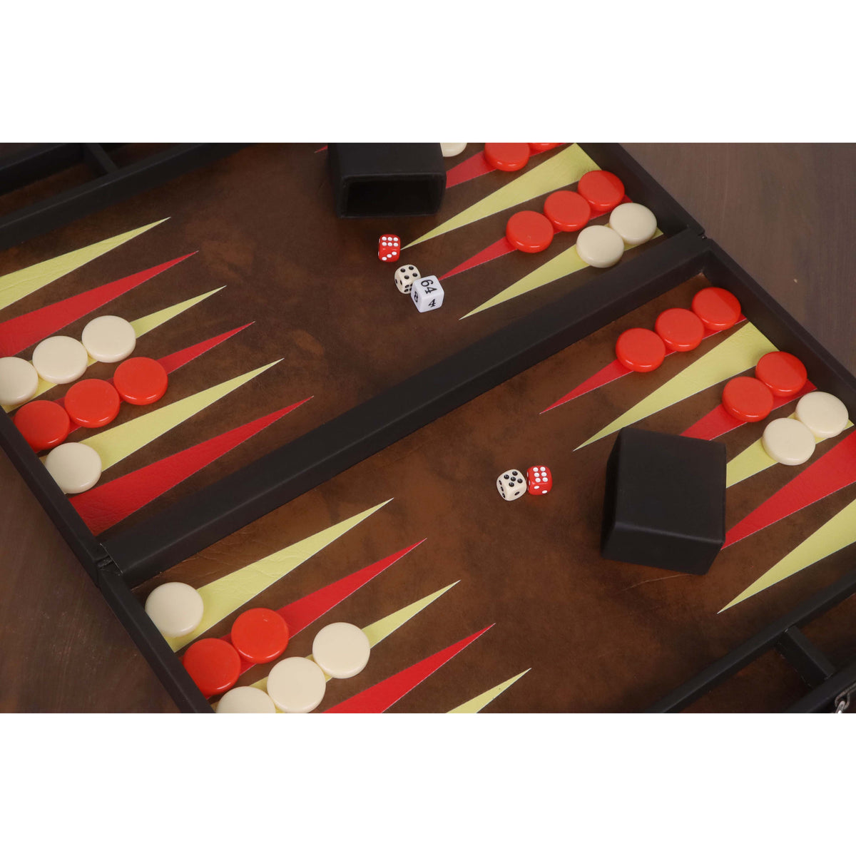 Detailed view of the backgammon set interior featuring black dice cups and ivory-colored dice.
