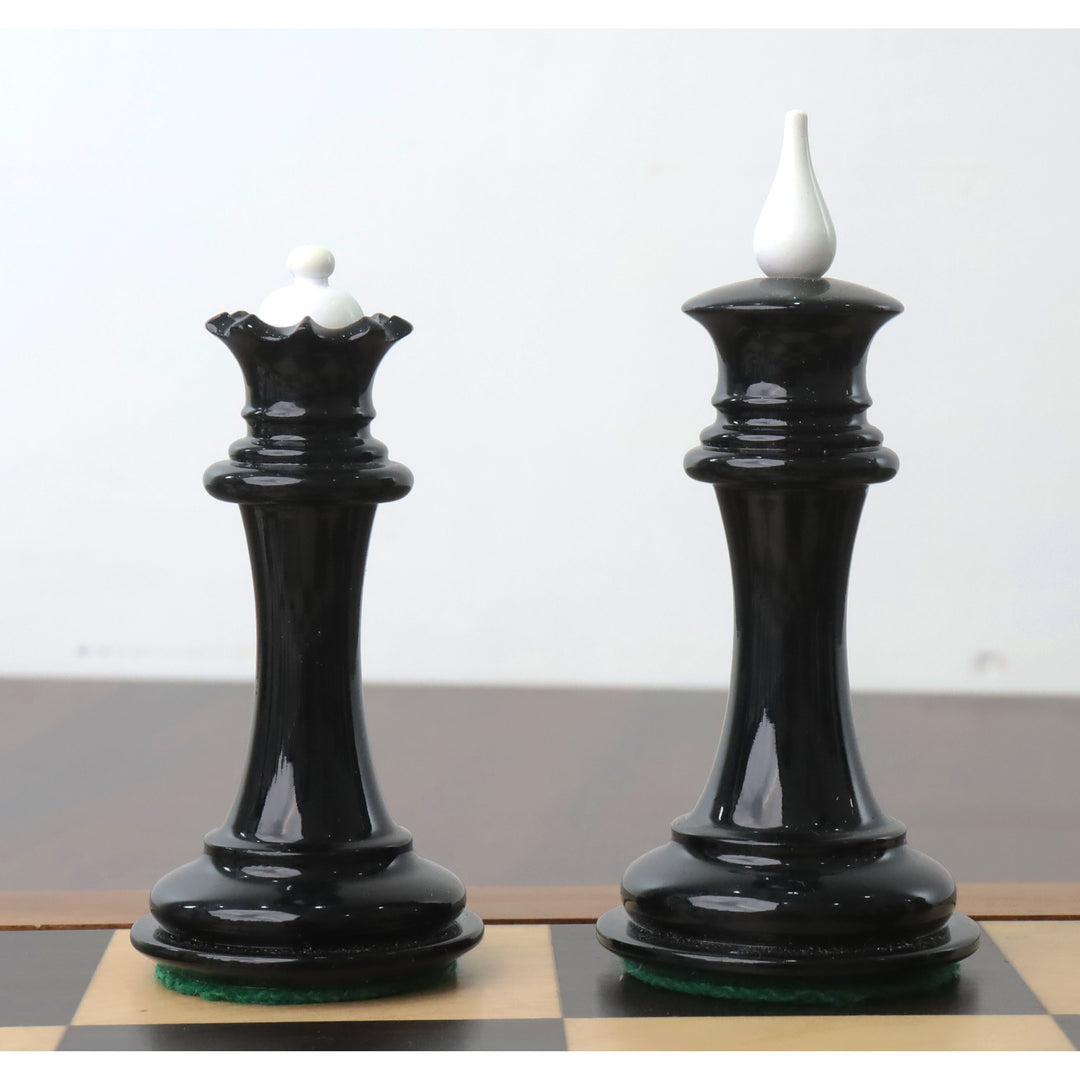 Elegant black lacquer Soviet reproduction king and queen pieces with contrasting white finials.