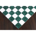 Detail of the corner squares on a 15 inch green malachite and white stone borderless chess board.