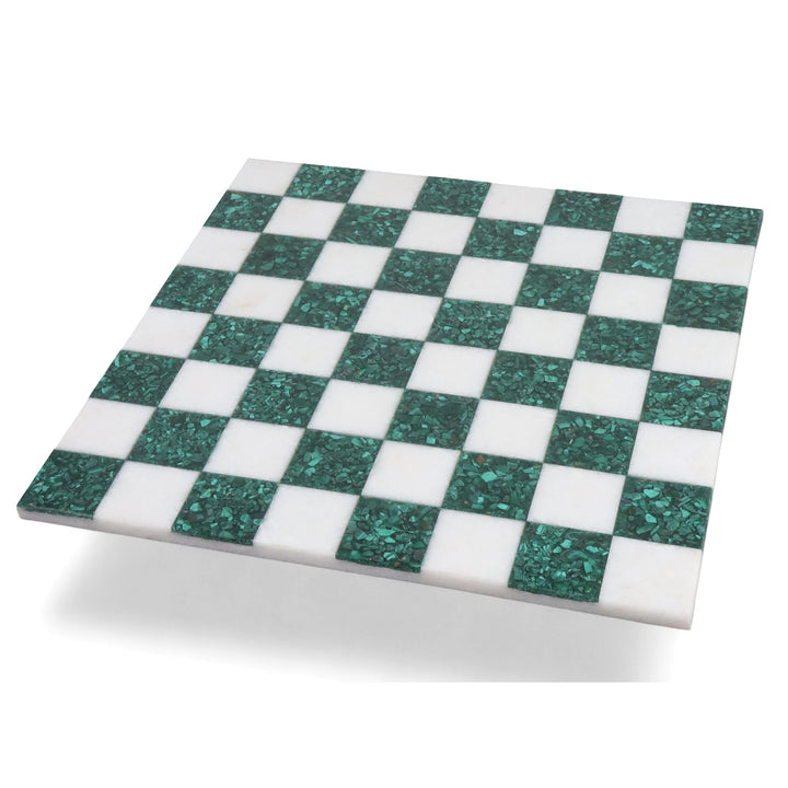 Angled view of a 15 inch borderless malachite stone luxury chess board with green and white squares.