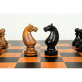 Distressed antiqued and ebonised boxwood Soviet Knights showing distinct manes and carved profiles.