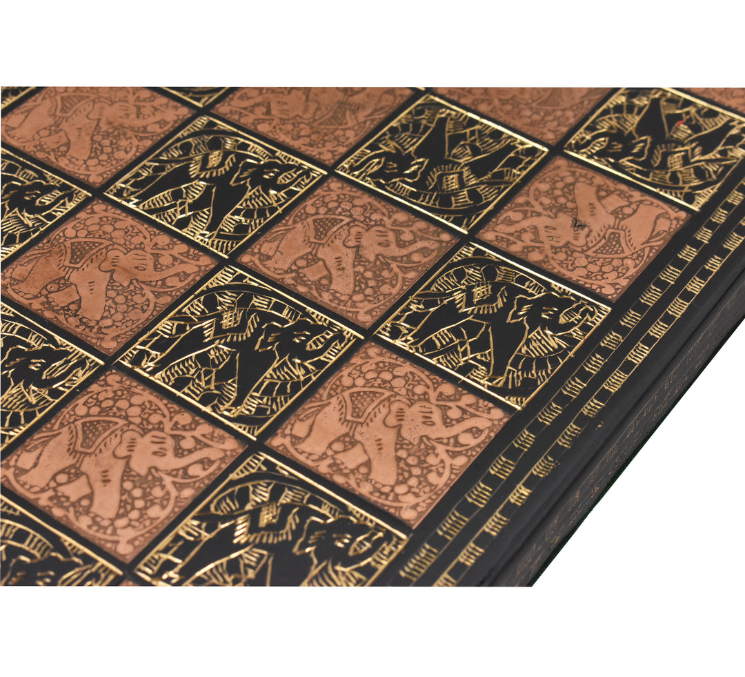 Detailed close-up of hand-etched elephant designs on a luxury copper and black brass chess board.