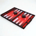 Perspective view of an 18-inch briefcase-style backgammon board with red and white surface.