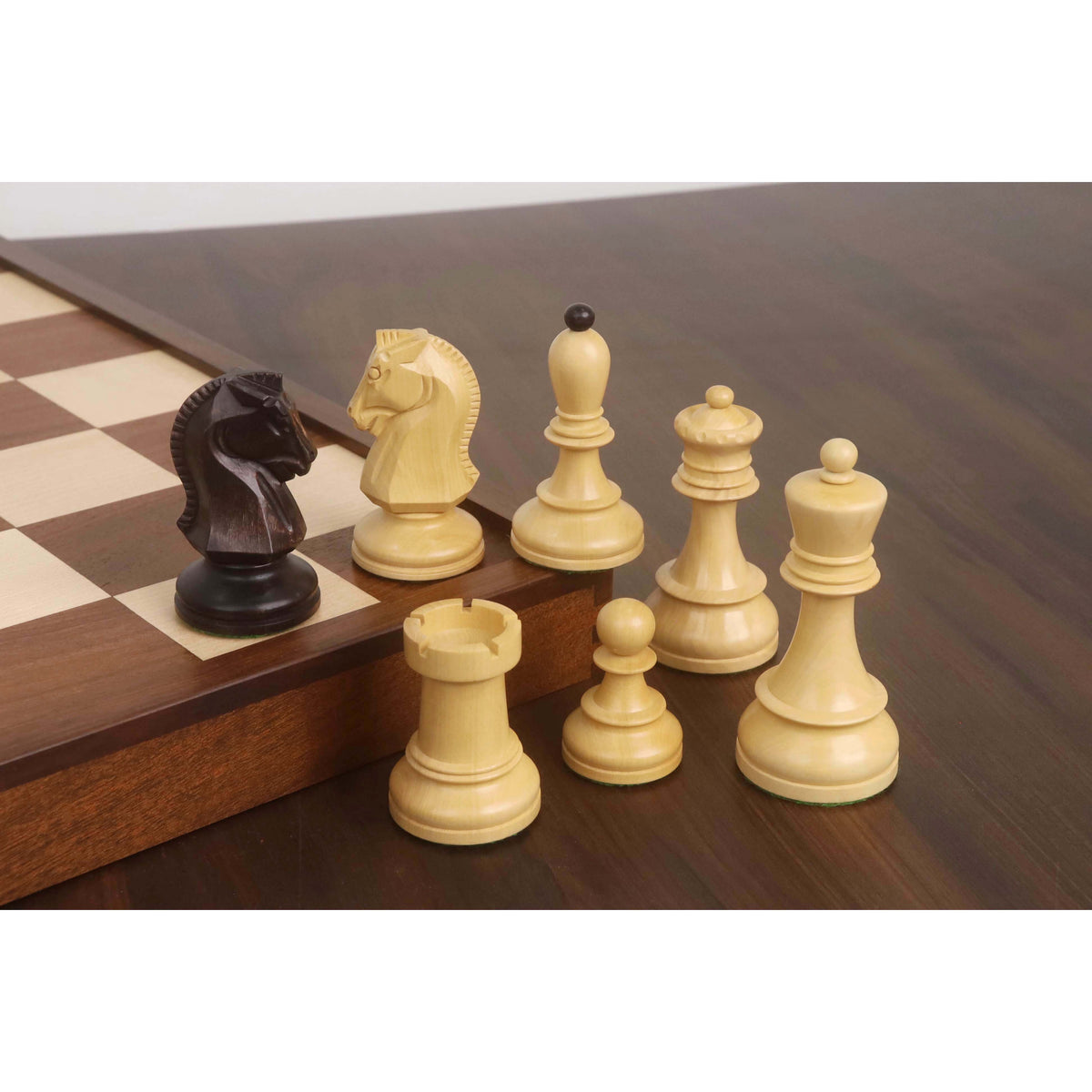 Assortment of boxwood Dubrovnik chess pieces including king, queen, and bishop with dark ball finial.