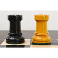 Side-by-side view of ebonized and antiqued boxwood Rooks from the Dubrovnik chess series.