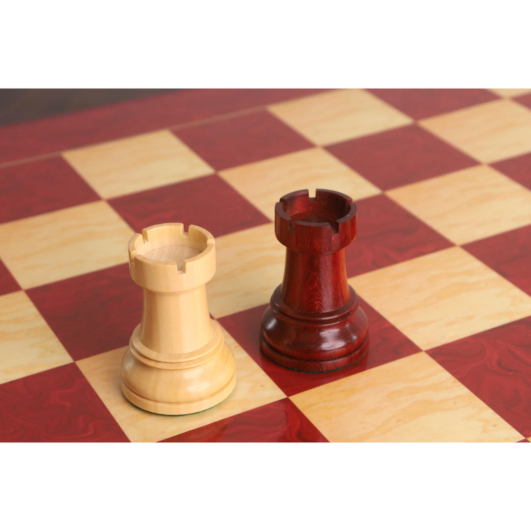Bud Rosewood and Boxwood rooks from the Fischer Dubrovnik set on a red marbled chess board.