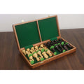 Interior of a green felt-lined folding chess board showing secure storage for Dubrovnik style pieces.