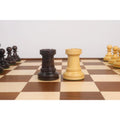 Ebonized and boxwood Dubrovnik chess rooks featuring the traditional 1950s wide-cut battlements.