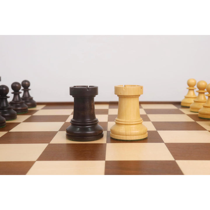 Ebonized and boxwood Dubrovnik chess rooks featuring the traditional 1950s wide-cut battlements.