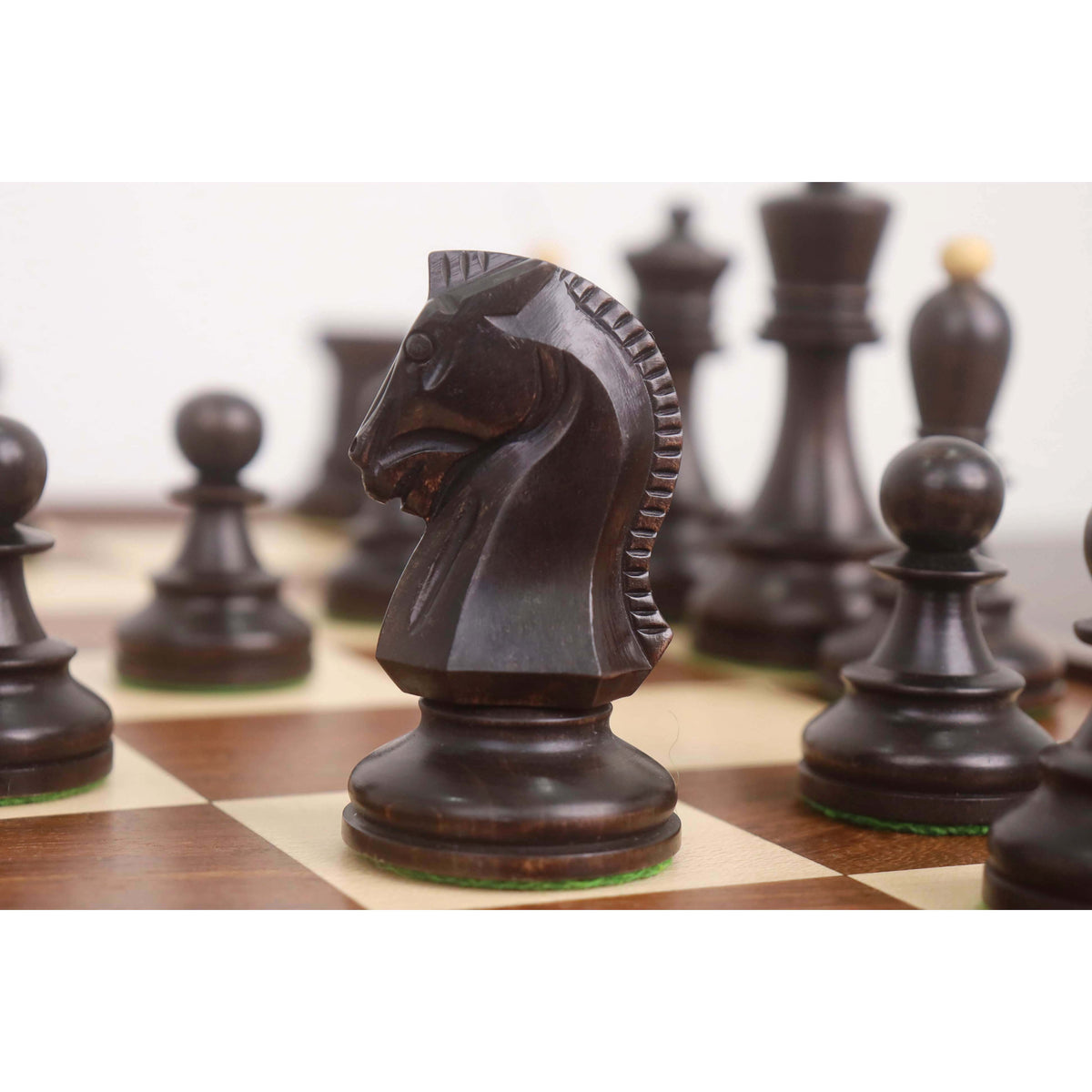 Detailed macro shot of an ebonized 1950s Dubrovnik knight piece highlighting the hand-carved mane.