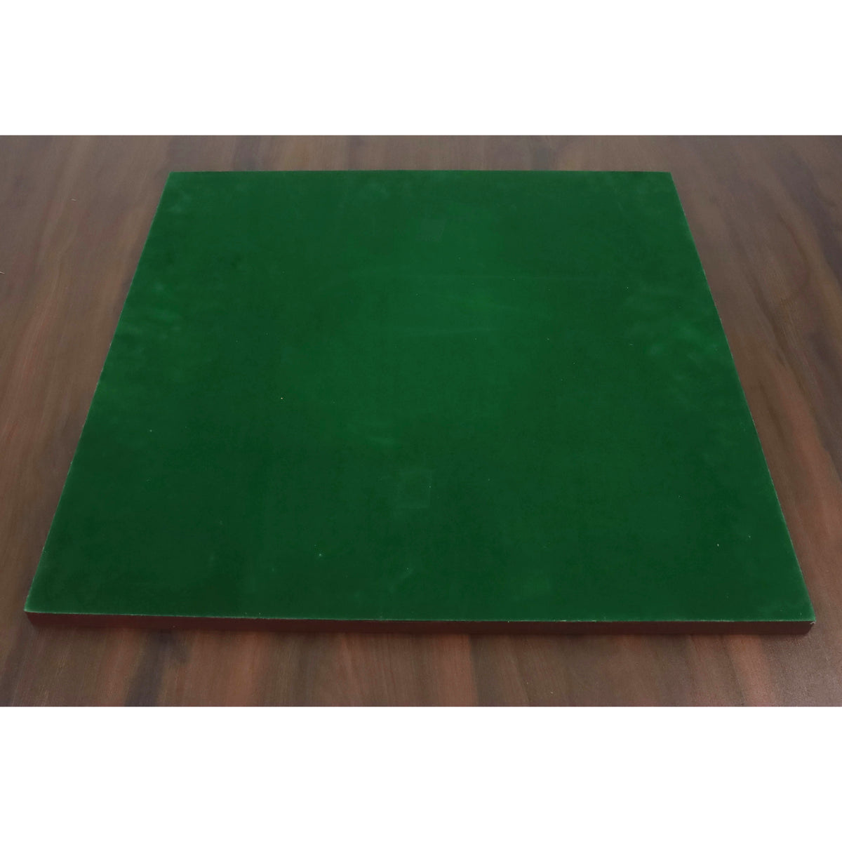 Underside of a chess board covered in premium green felt to protect furniture surfaces.