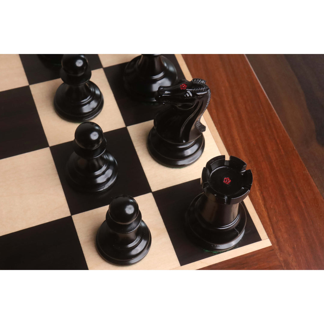 Polished ebony chess pieces featuring the traditional red king's side stamping on knight and rook.