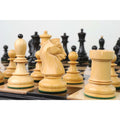 Depth-of-field shot focusing on a boxwood Fischer Dubrovnik knight among other chess pieces.