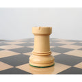 Detailed side profile of a boxwood rook from the 1950s Fischer Dubrovnik chess set collection.