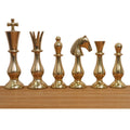 Full set profile of gold brass minimalist chess pieces from king to pawn on a wooden base.