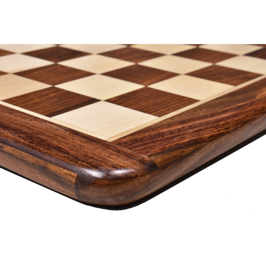 Detailed view of the polished rounded corner of a golden rosewood and maple wood inlaid chess board.
