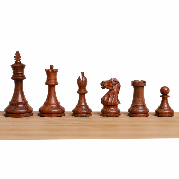 Complete set of golden rosewood magnetic chess pieces arranged by rank on a wooden surface.