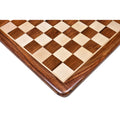Close-up of a 17 inch inlaid wooden chess board corner featuring golden rosewood and maple squares.