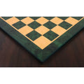 Perspective lifestyle shot of the 22" green ash burl and boxwood printed chess board with a reflective gloss finish.