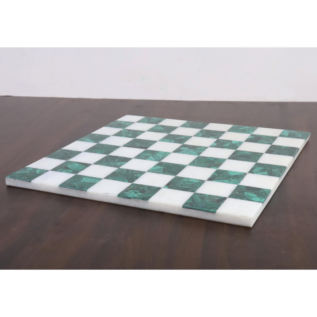 Side profile of a 15 inch borderless green malachite and white stone luxury chess board.