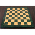 A large tournament-sized 22-inch green ash burl wood printed chess board suitable for professional play.