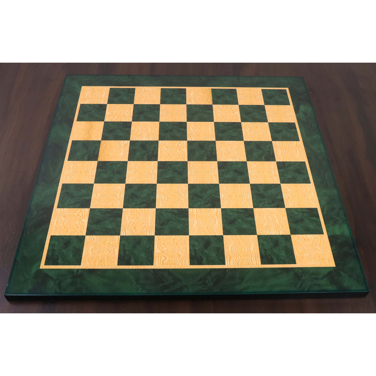 A large tournament-sized 22-inch green ash burl wood printed chess board suitable for professional play.