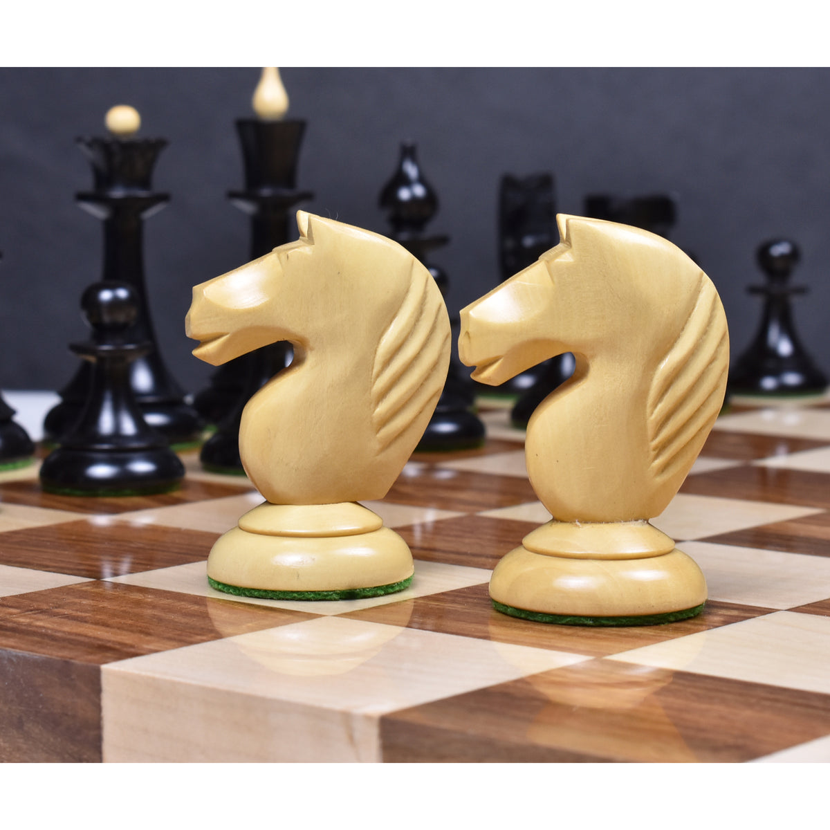 Close-up of handcrafted natural boxwood Knights from the 1950s Soviet Latvian reproduction set.