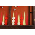 Close-up of textured leatherette backgammon board surface with red and cream playing points and chips.