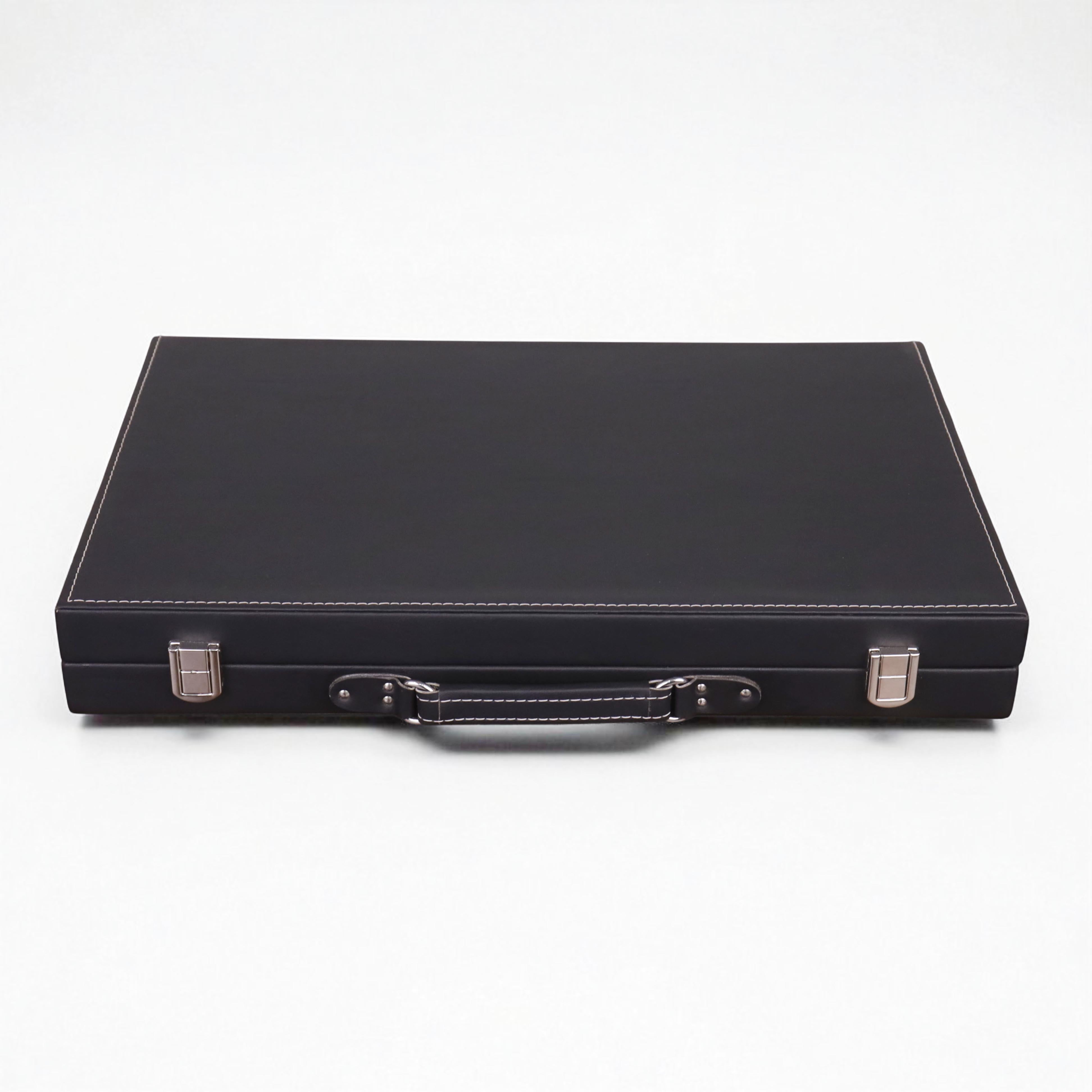 Closed luxury backgammon briefcase in ebony black leatherette with premium stitching and silver clasps.
