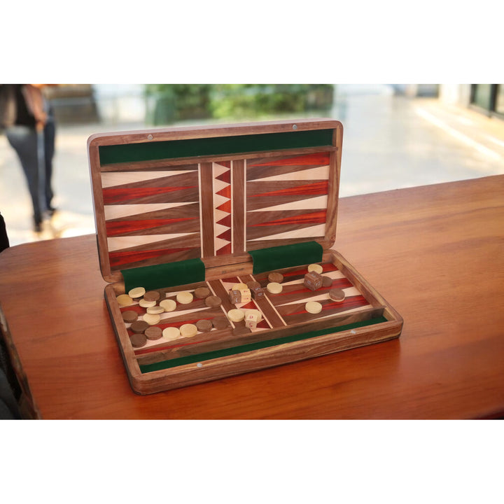 Handcrafted luxury travel backgammon set with bud rosewood inlays displayed on a wooden surface.