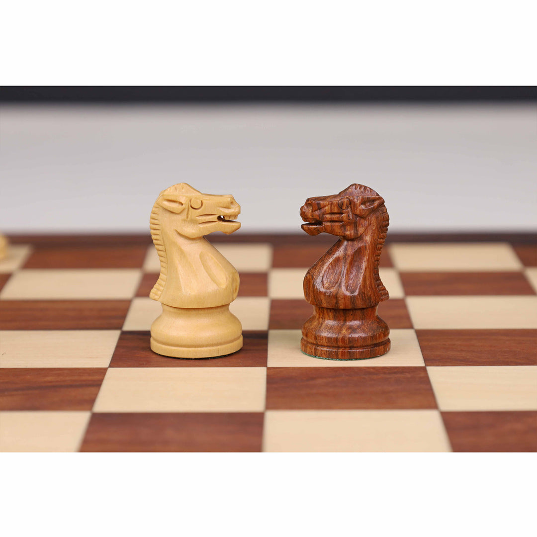 Carved magnetic knights in boxwood and golden rosewood from the minimalist travel chess set.
