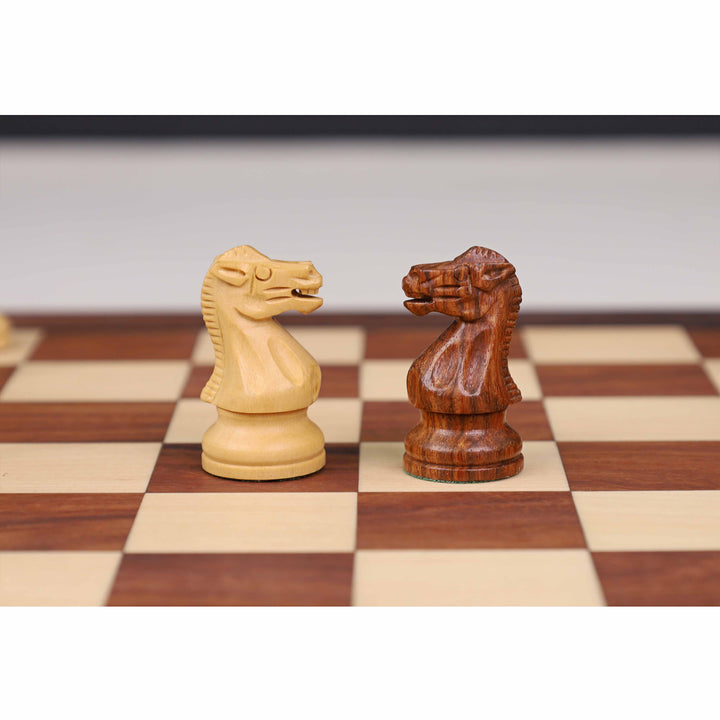 Carved magnetic knights in boxwood and golden rosewood from the minimalist travel chess set.