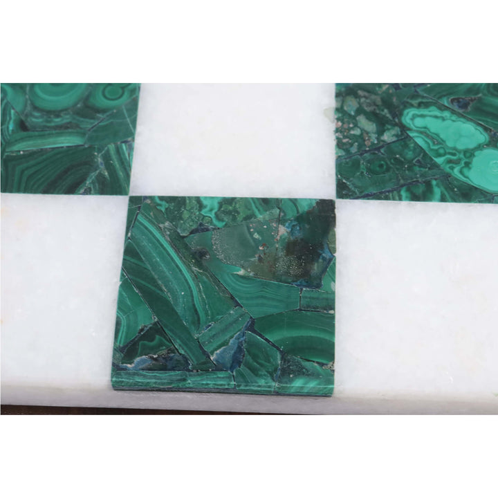 Detailed texture of a genuine green malachite square on a luxury semi-precious stone chess board.