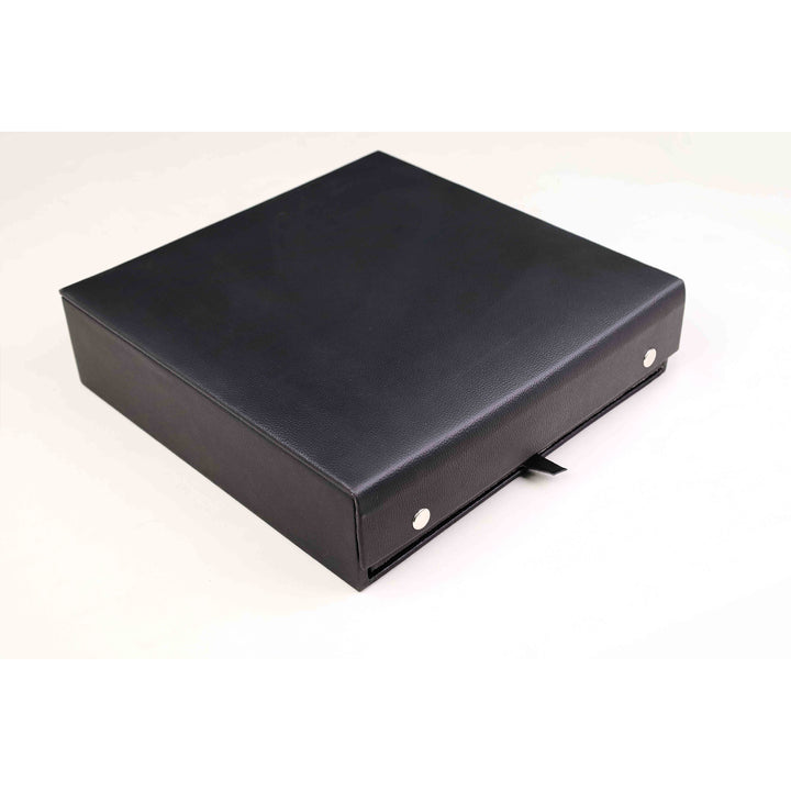 Elegant closed black storage box for a 12 inch magnetic travel chess set with silver accents.