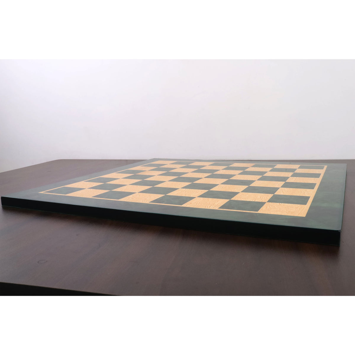 Side view showing the profile and thickness of the 22-inch green wood printed chess board.