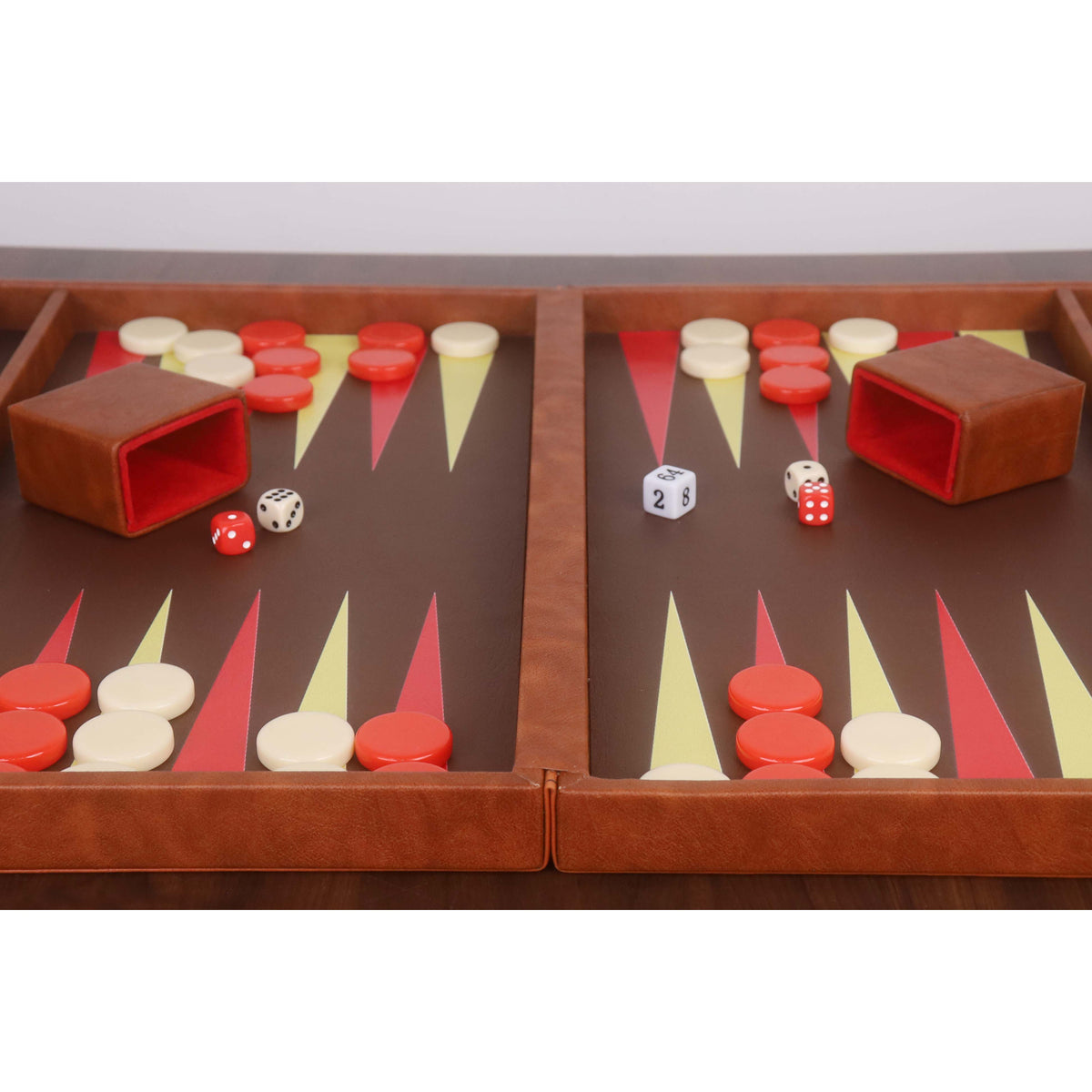 Detailed view of the interior playing field and two brown leatherette dice cups with red velvet lining.