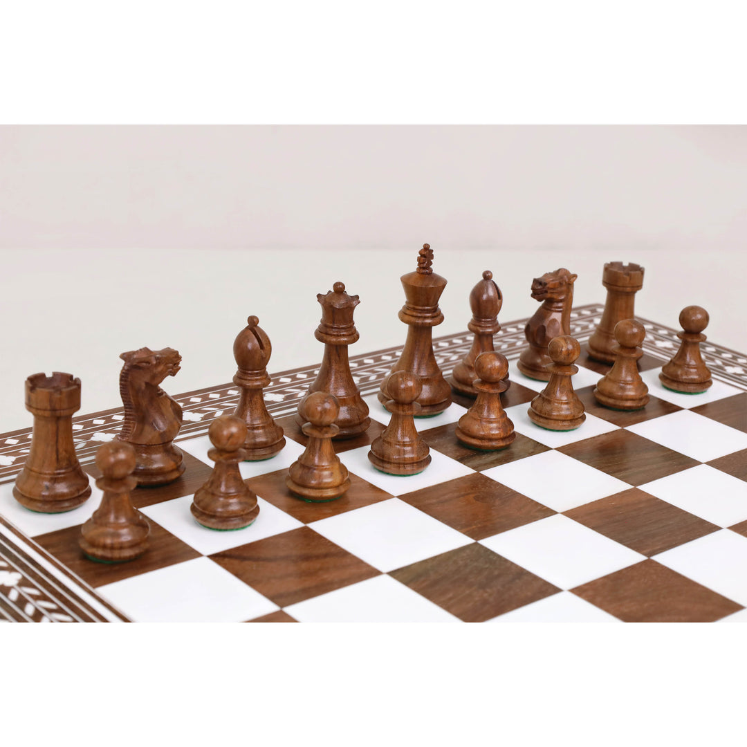 Rosewood Staunton chess pieces displayed on Regency Inlaid folding chess board