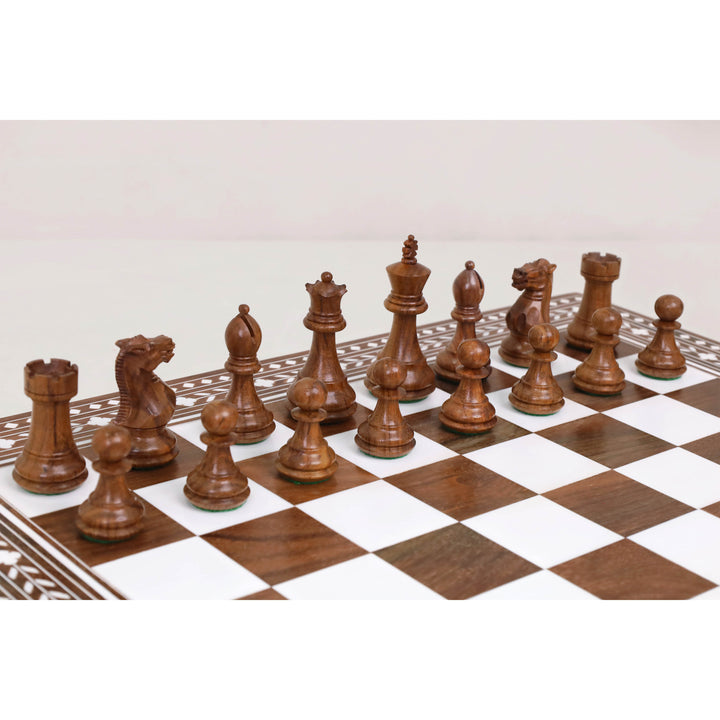 Rosewood Staunton chess pieces displayed on Regency Inlaid folding chess board