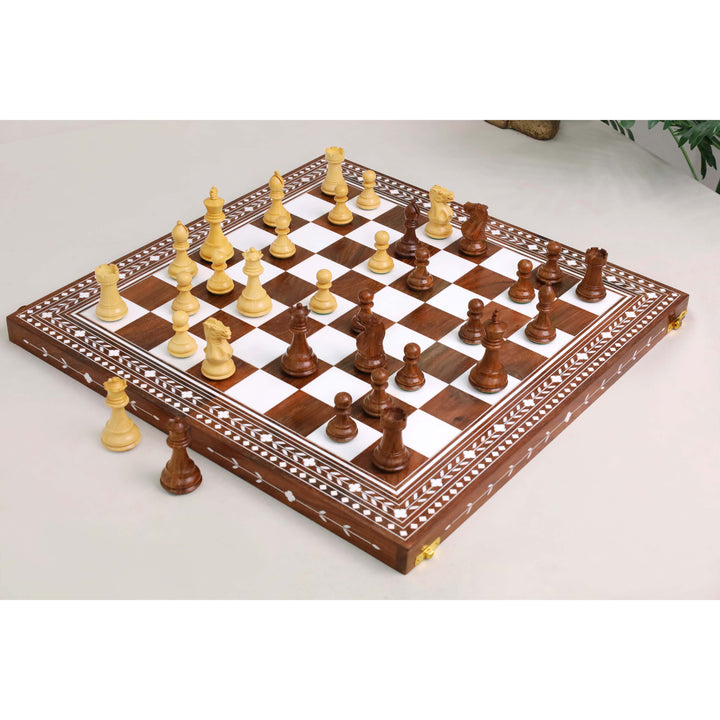 Maple Staunton chess pieces stored inside red felt-lined compartment of folding chess board