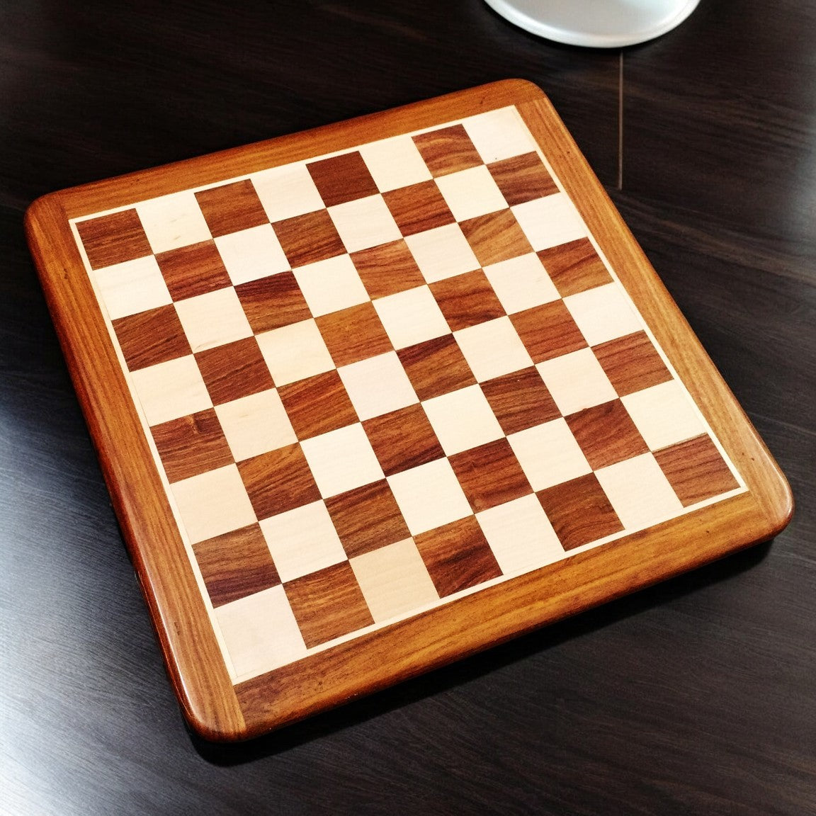 Top view of a 19 inch solid inlaid wood chess board featuring golden rosewood and maple wood squares.