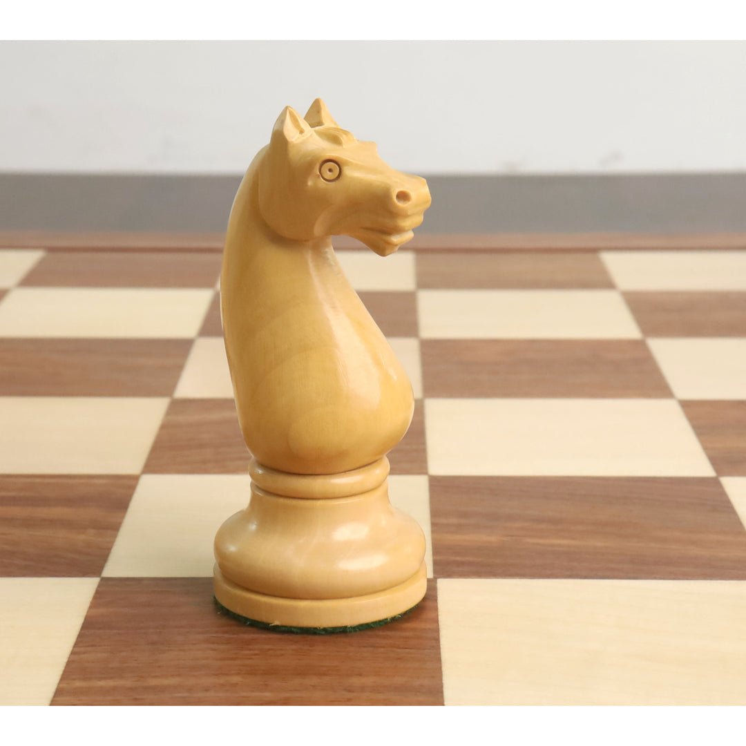 Hand-carved Boxwood knight from the 1935 Soviet Botvinnik-Flohr II chess set on a wooden board.
