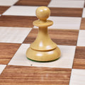 Natural boxwood pawn from the 1950s Soviet Latvian reproduction set showing the curved base and slim collar.