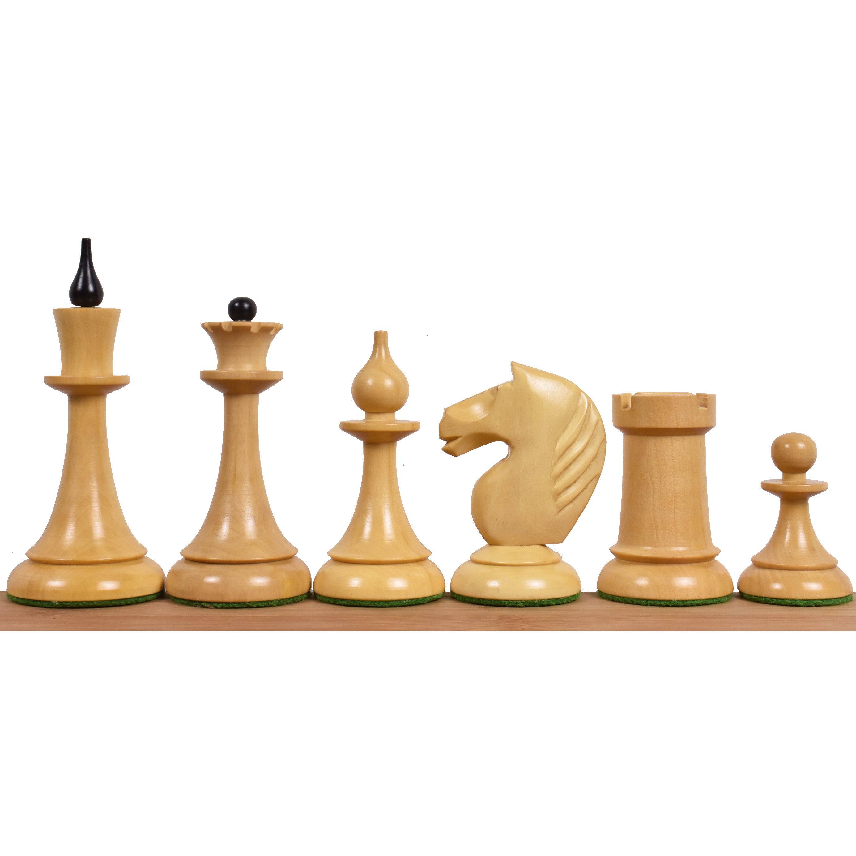 Natural boxwood 1950s Soviet Latvian chess pieces showing the unique slim stems and knight carving.