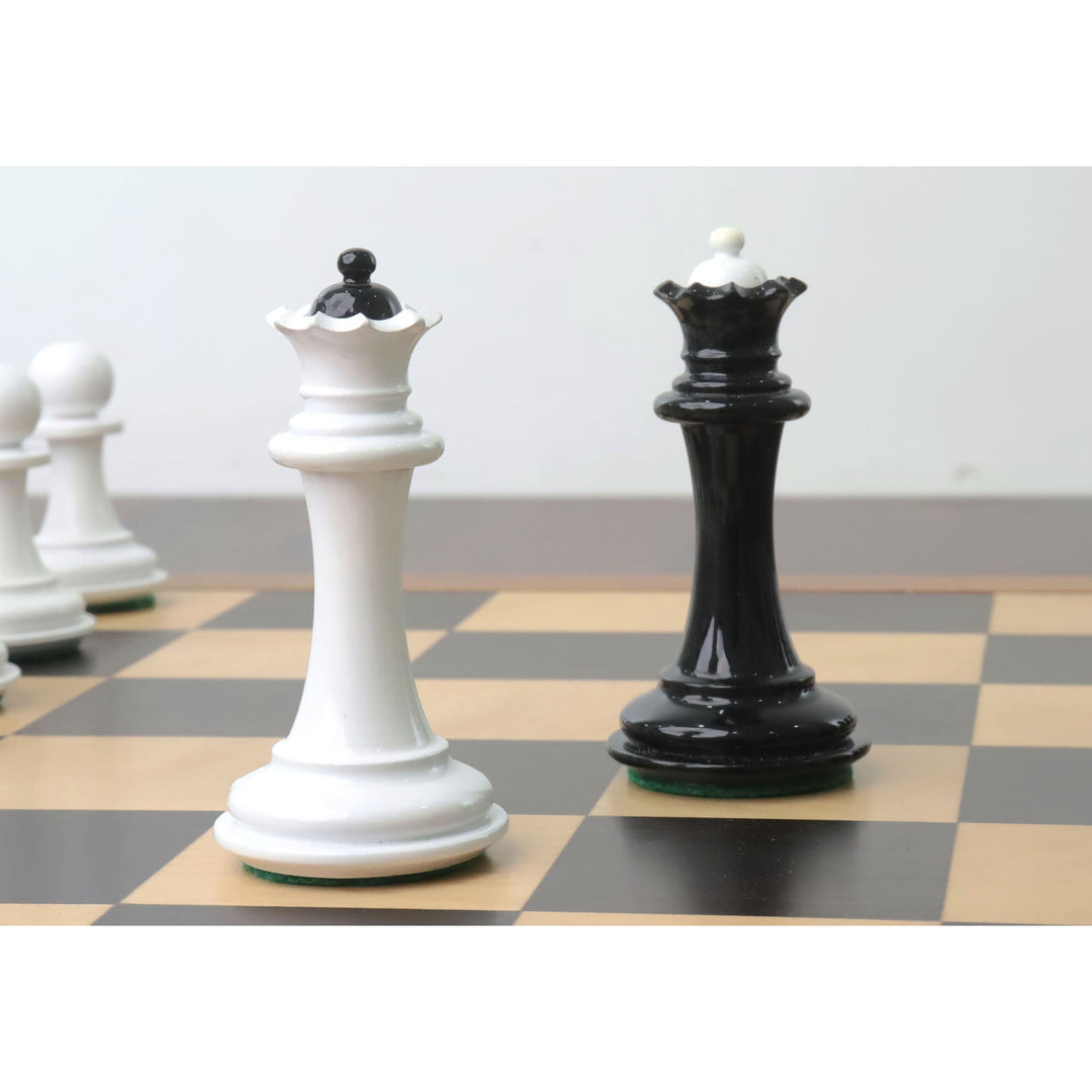 Soviet era reproduction black and white lacquer boxwood queen chess pieces on a board.