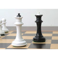Soviet era reproduction black and white lacquer boxwood queen chess pieces on a board.